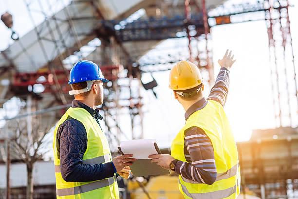 images of engineers inspecting workers